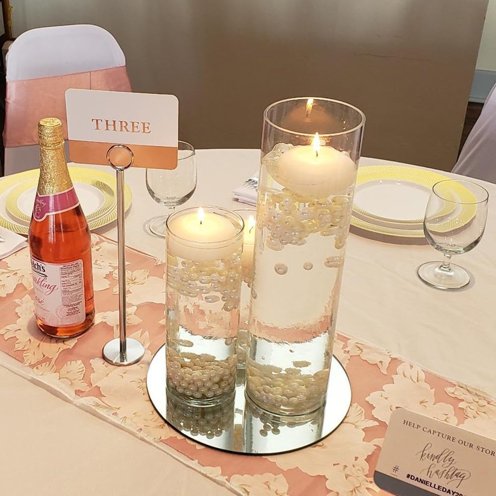 Elegant table setting with floating candles, reflecting beauty for special occasions.